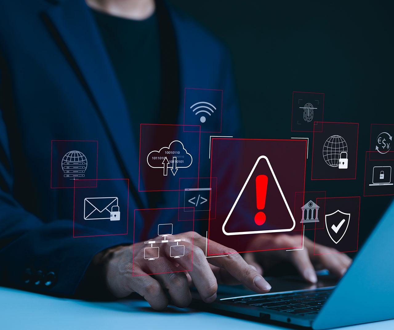 Man with computer showing alerts